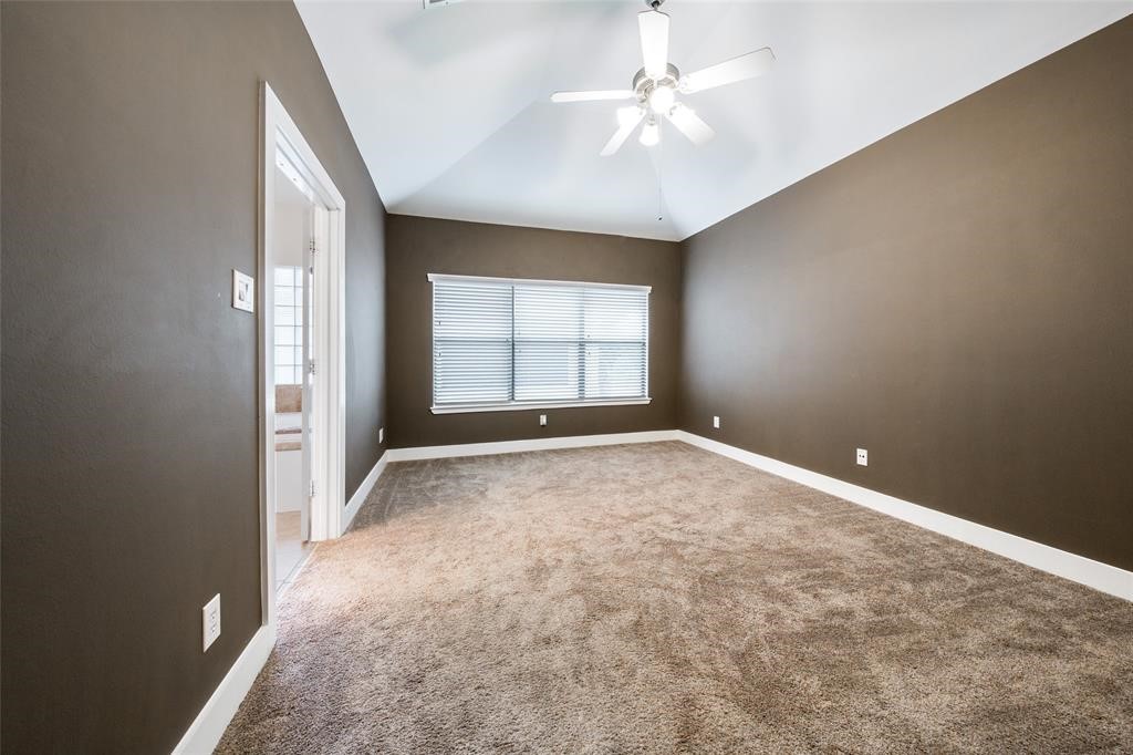 3027 Buttercup Street Houston, TX 77063 - Photo 3 of 29 an empty room with windows and chandelier fan