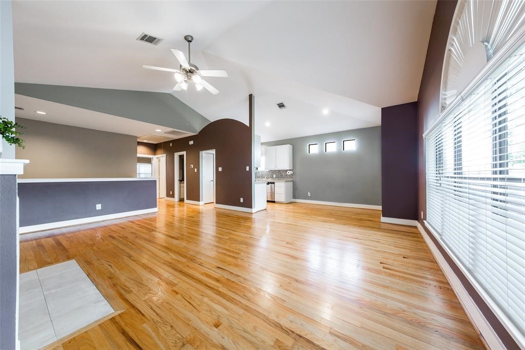 3027 Buttercup Street Houston, TX 77063 - Photo 9 of 29 a view of an empty room with window and wooden floor