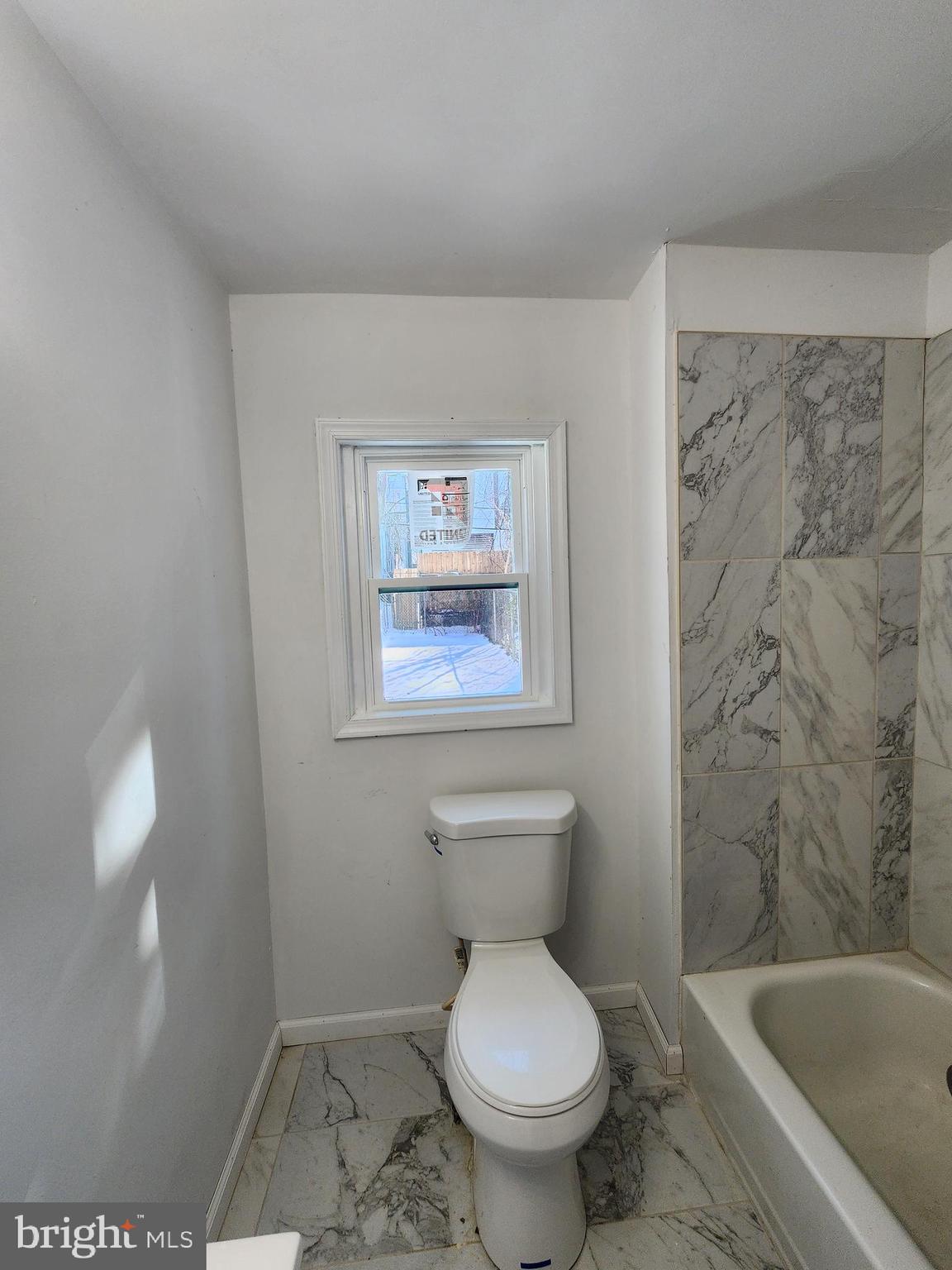 6616 Leeds Street Philadelphia, PA 19151 - Photo 13 of 29 a bathroom with a toilet and a bathtub