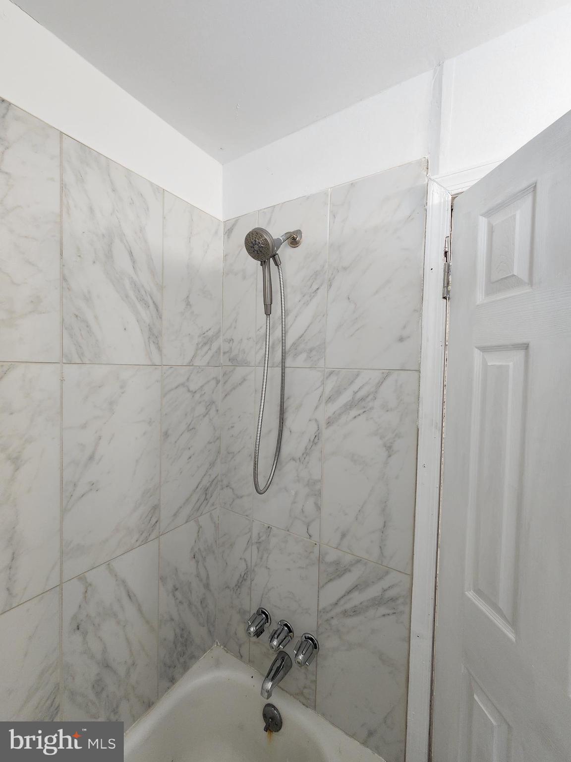 6616 Leeds Street Philadelphia, PA 19151 - Photo 14 of 29 a bathroom with a shower