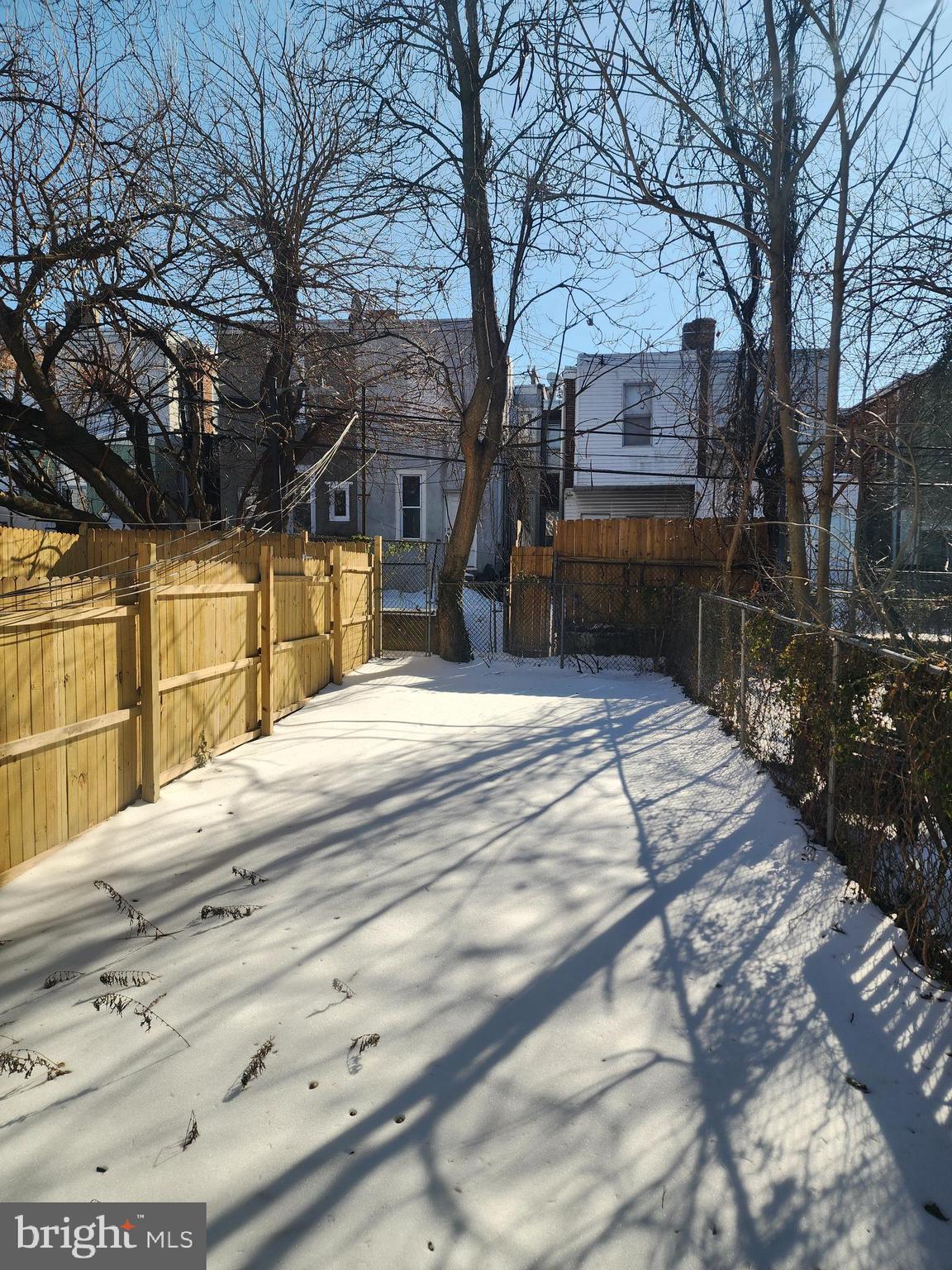 6616 Leeds Street Philadelphia, PA 19151 - Photo 16 of 29 a view of a backyard with a large tree