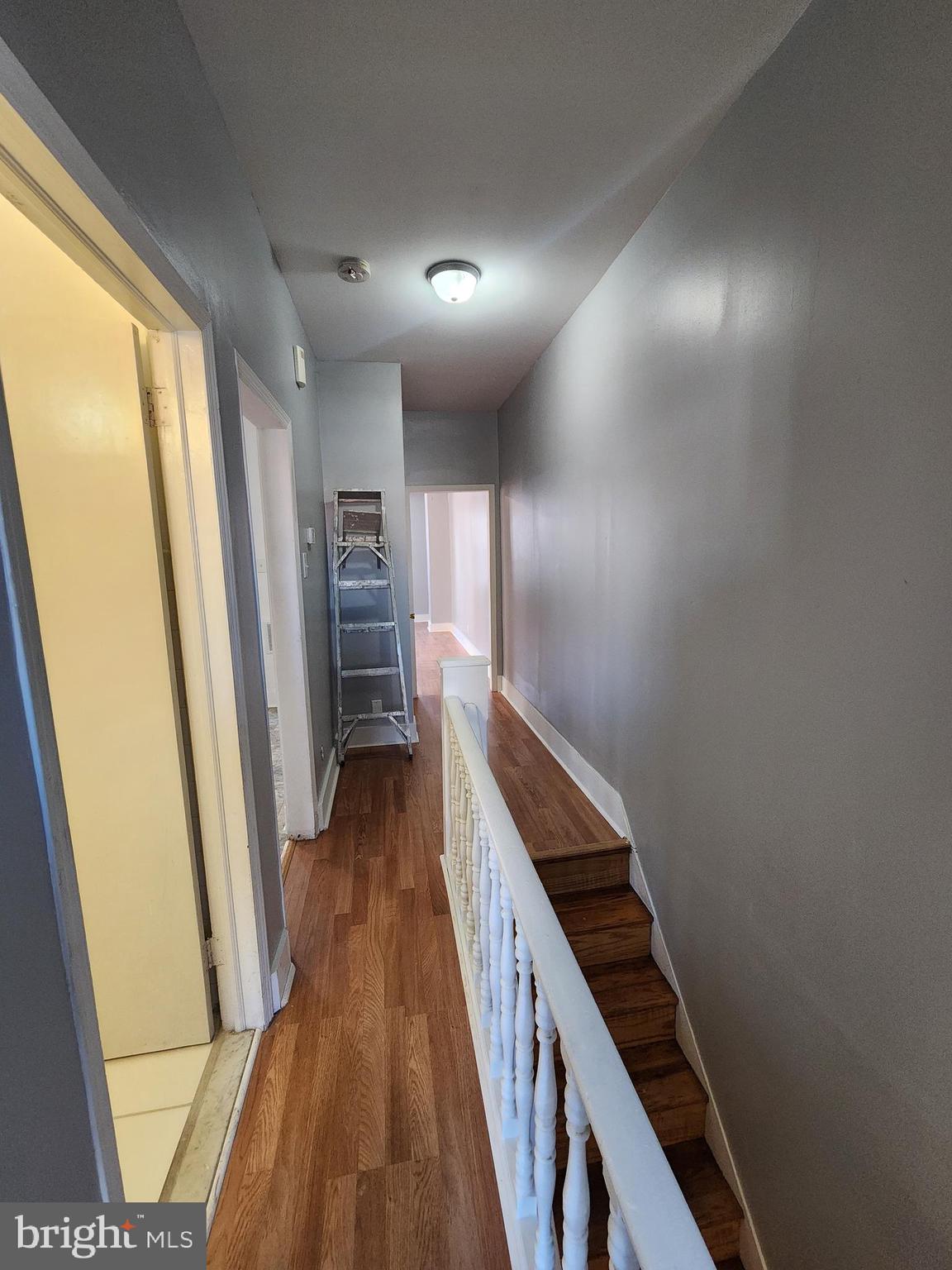 6616 Leeds Street Philadelphia, PA 19151 - Photo 18 of 29 a view of a hallway with wooden floor and stairs