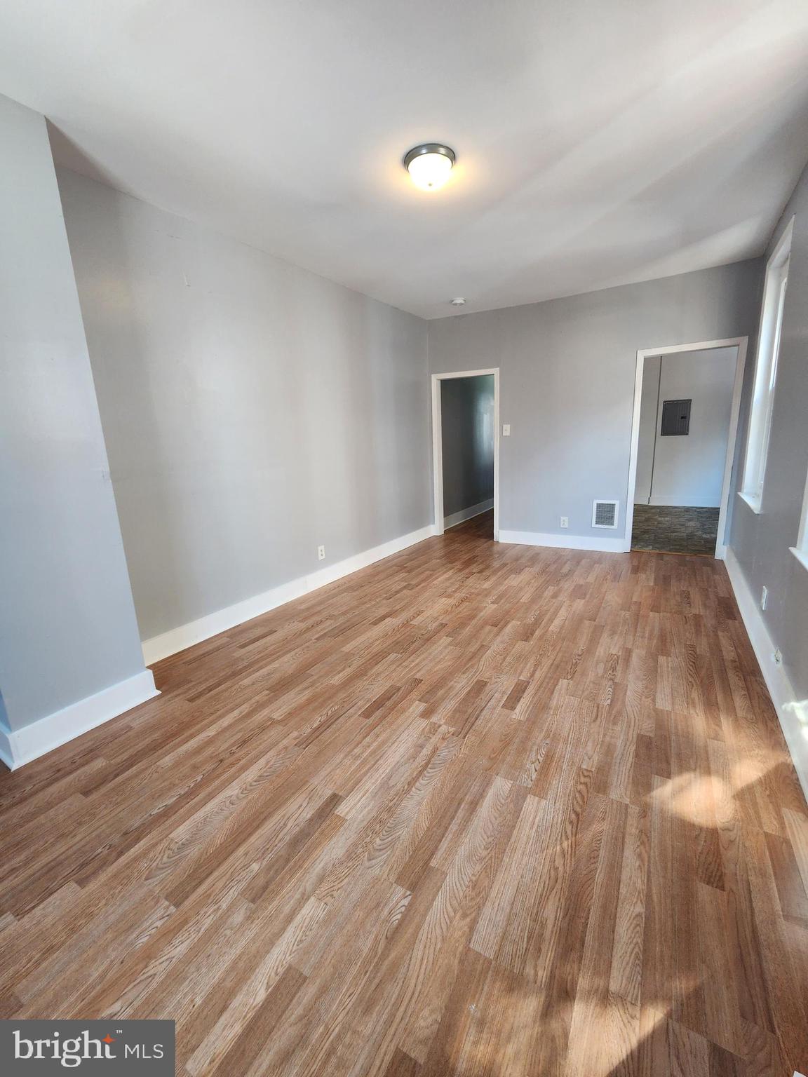 6616 Leeds Street Philadelphia, PA 19151 - Photo 20 of 29 a view of a livingroom with wooden floor and staircase