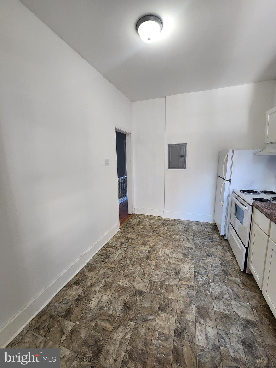 6616 Leeds Street Philadelphia, PA 19151 - Photo 22 of 29 a view of a refrigerator in kitchen and a sink