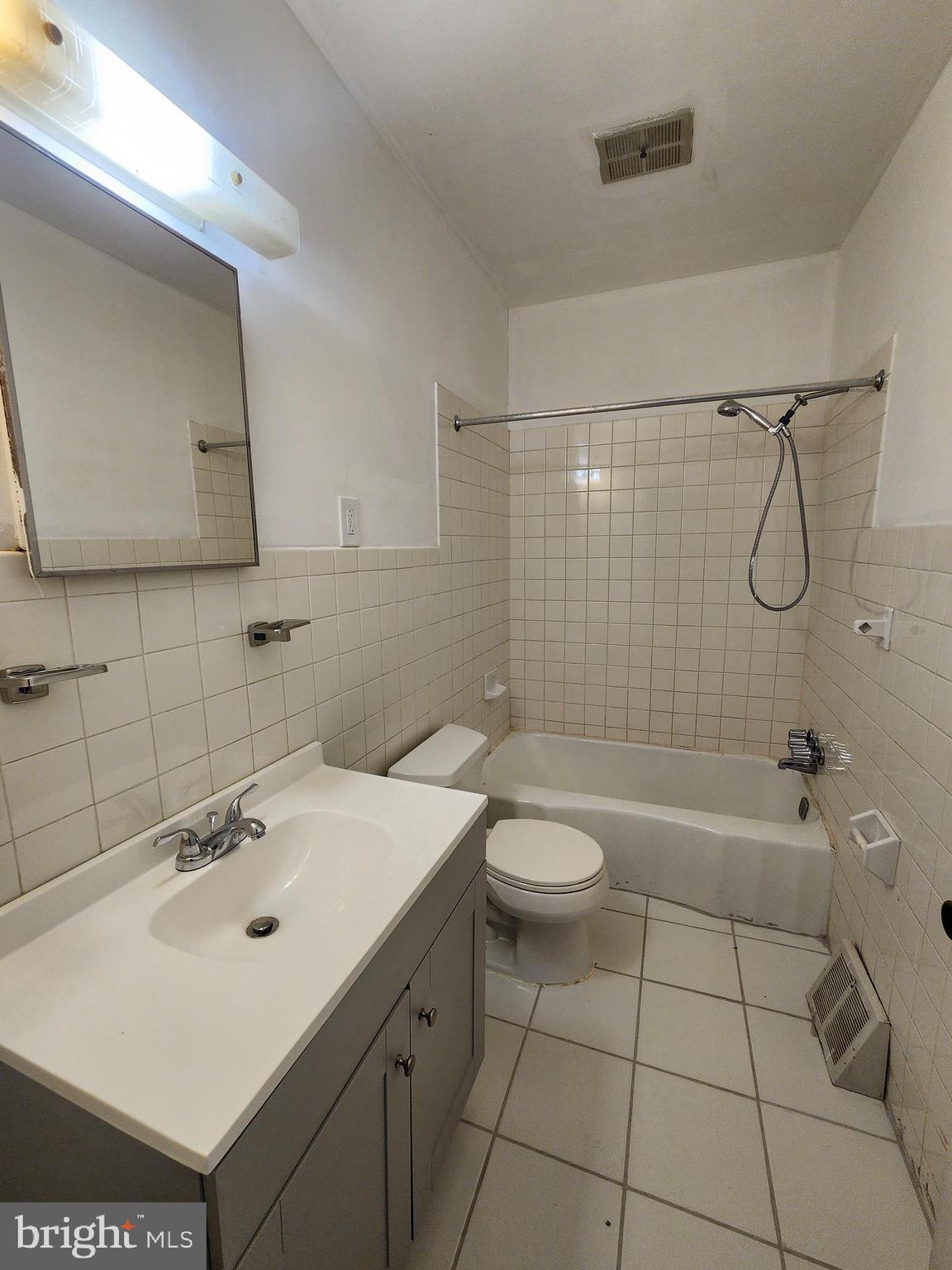6616 Leeds Street Philadelphia, PA 19151 - Photo 24 of 29 a bathroom with a sink a toilet and shower