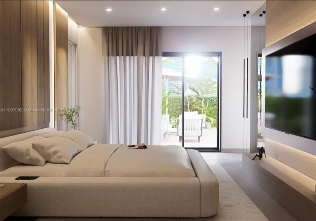 a bedroom with a large bed and a large window