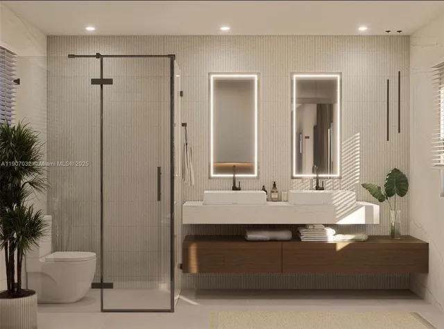 a bathroom with a granite countertop sink a mirror and a shower