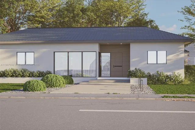 a house with a yard and a car parked in front of it