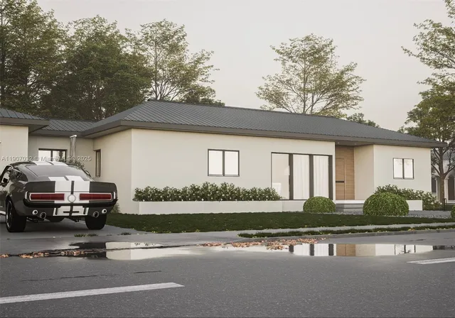 a front view of a house with a garden and lake view