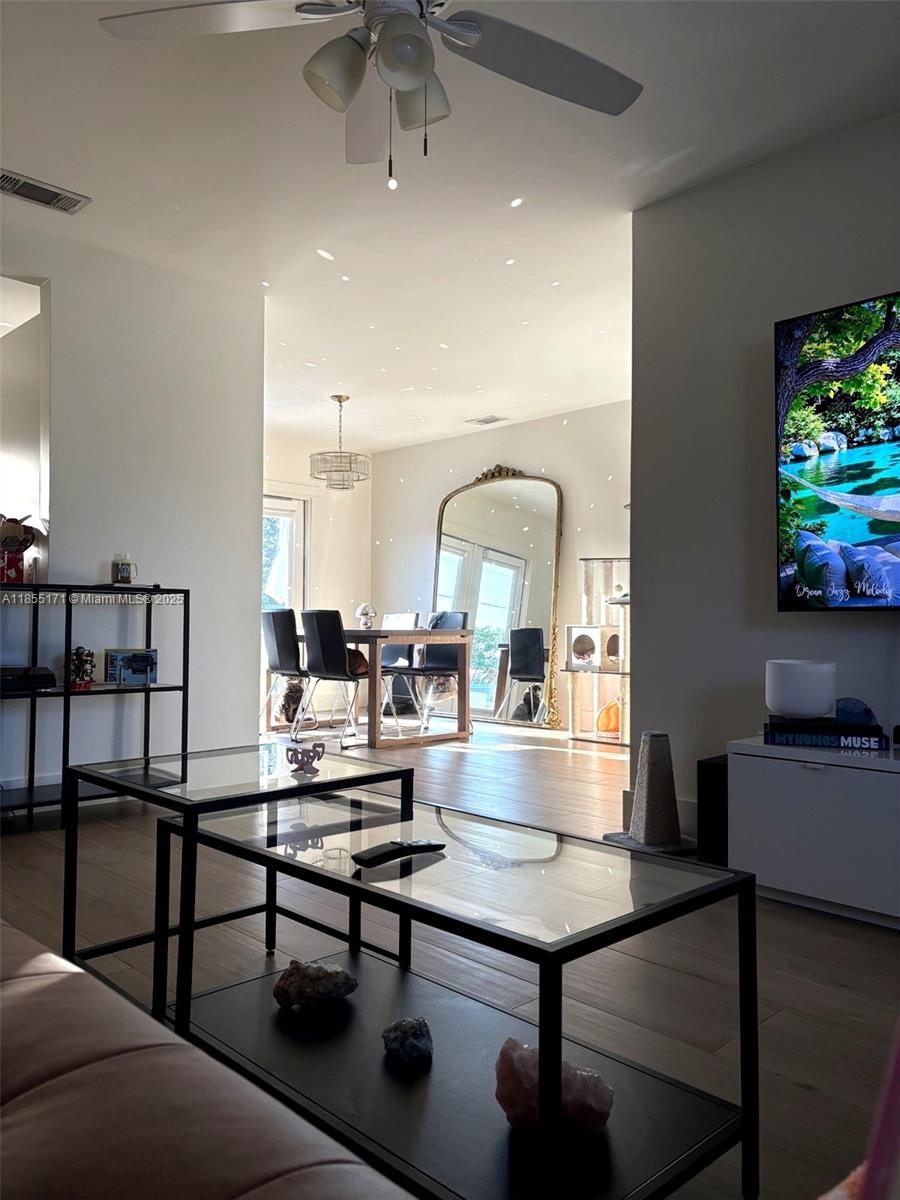 2273 Southwest Mt Vernon Street Port St. Lucie, FL 34953 - Photo 1 of 9 a living room with furniture and a flat screen tv