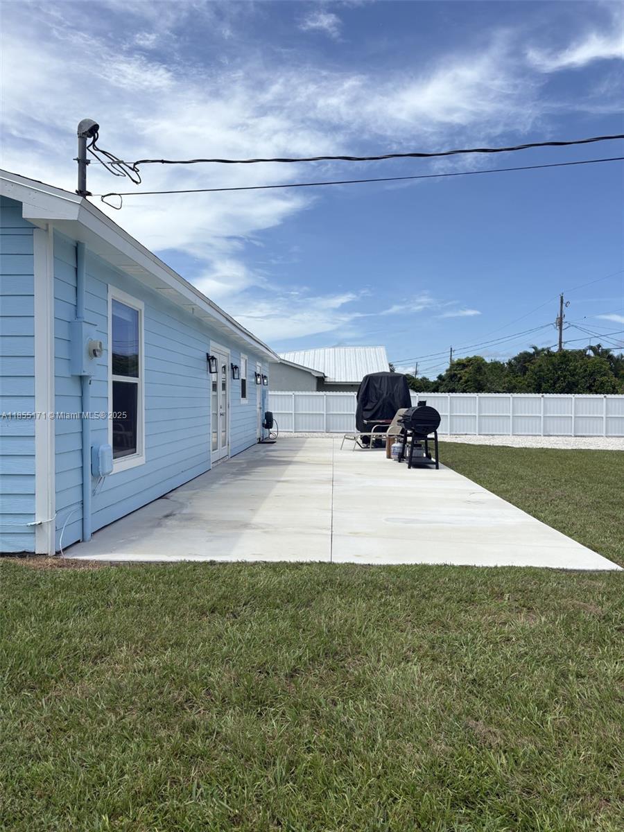2273 Southwest Mt Vernon Street Port St. Lucie, FL 34953 - Photo 6 of 9 a view of swimming pool with outdoor space and seating area