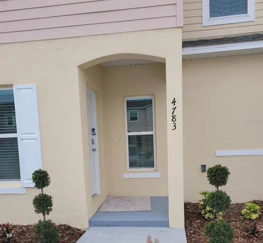 a view of kitchen with a sink and microwave
