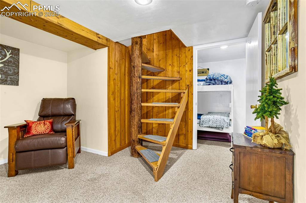 5870 Paona Road Cascade, CO 80809 - Photo 13 of 32 a bedroom with furniture and a window
