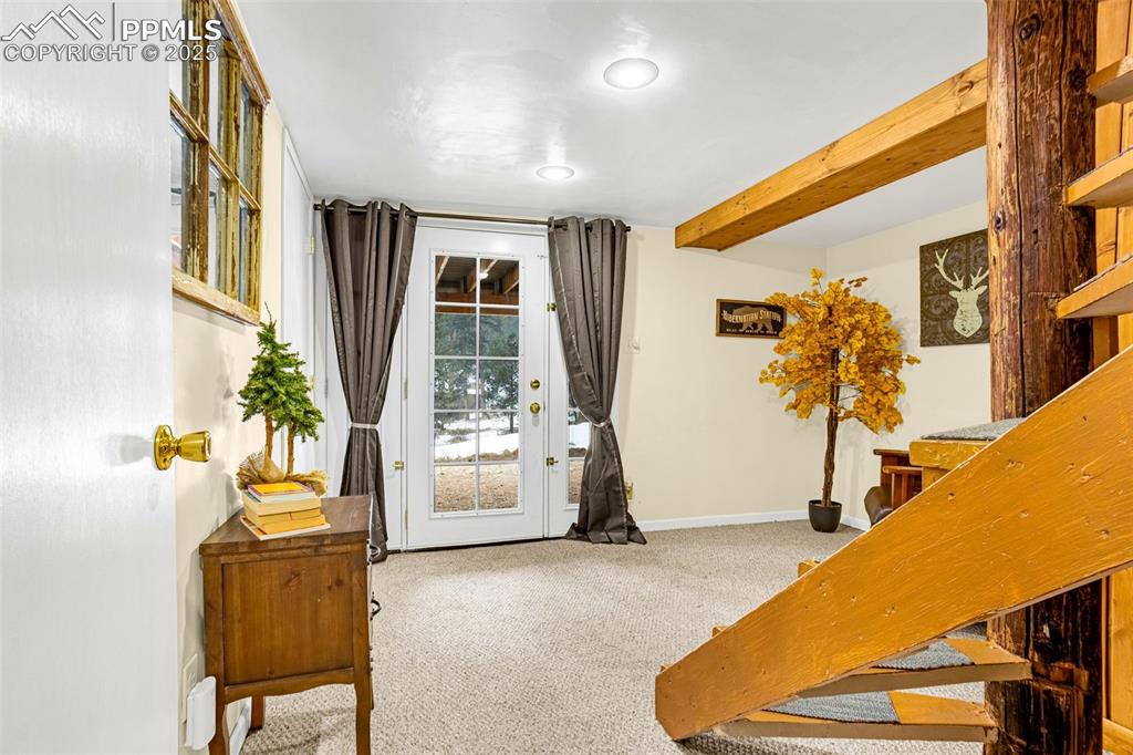 5870 Paona Road Cascade, CO 80809 - Photo 15 of 32 a bedroom with furniture and window