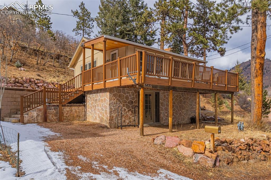 5870 Paona Road Cascade, CO 80809 - Photo 2 of 32 a view of a house with a yard