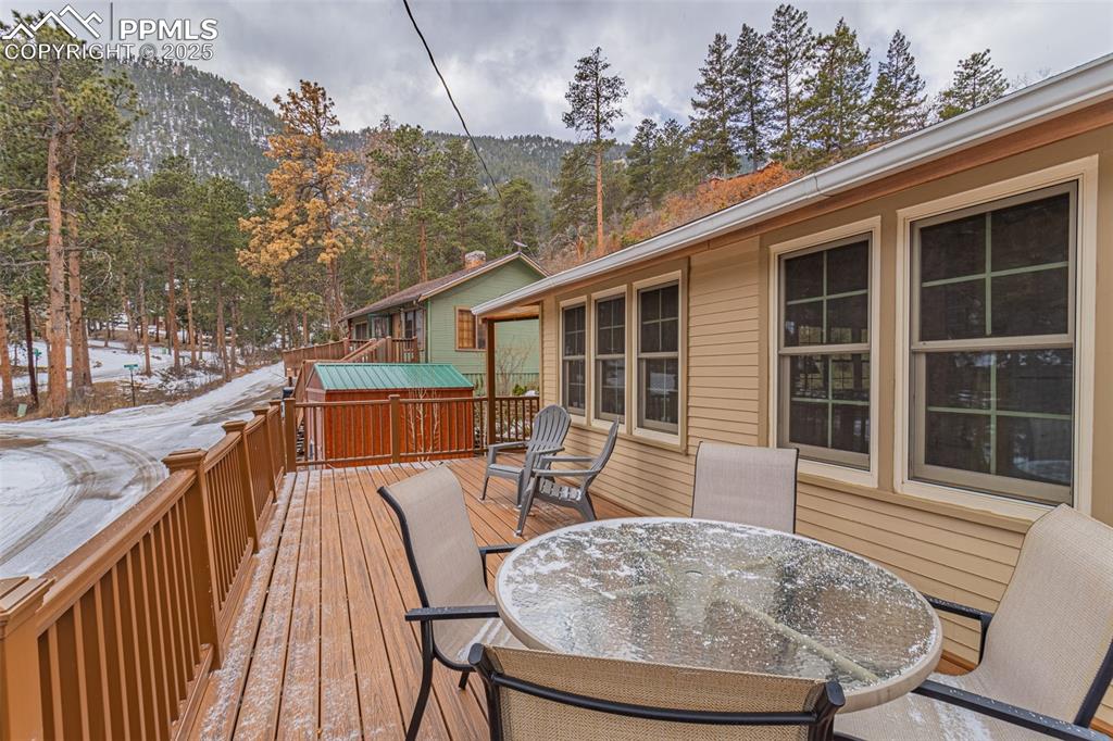 5870 Paona Road Cascade, CO 80809 - Photo 22 of 32 a view of a house with backyard and sitting area