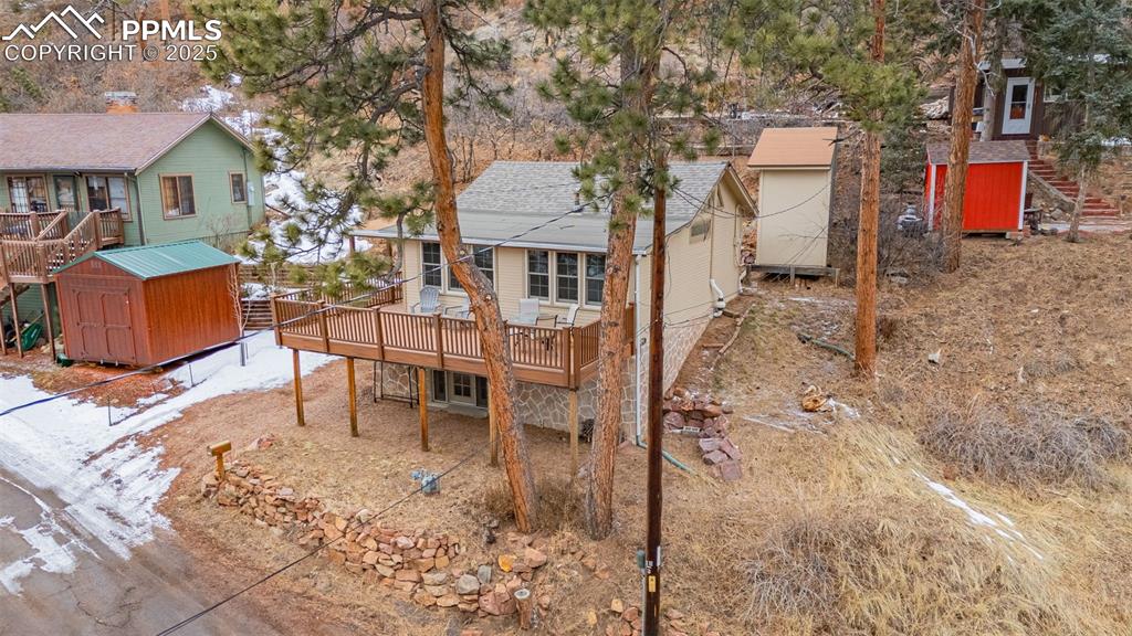 5870 Paona Road Cascade, CO 80809 - Photo 29 of 32 a backyard of a house with table and chairs