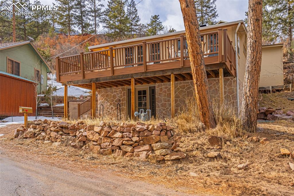 5870 Paona Road Cascade, CO 80809 - Photo 31 of 32 a front view of a house with a yard