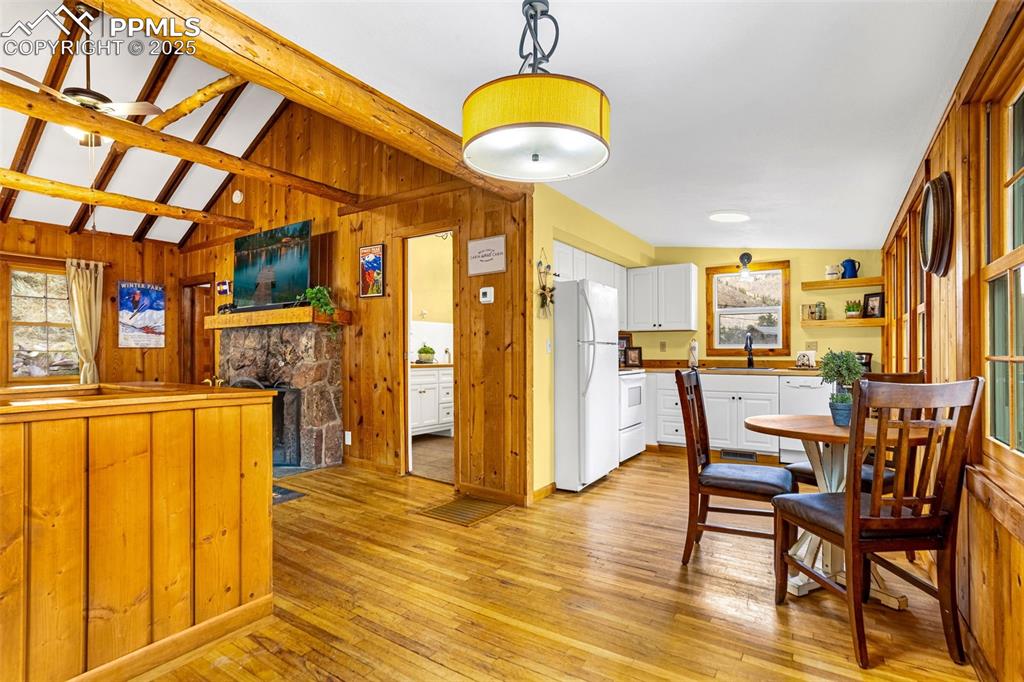 5870 Paona Road Cascade, CO 80809 - Photo 6 of 32 a dining room with furniture and wooden floor