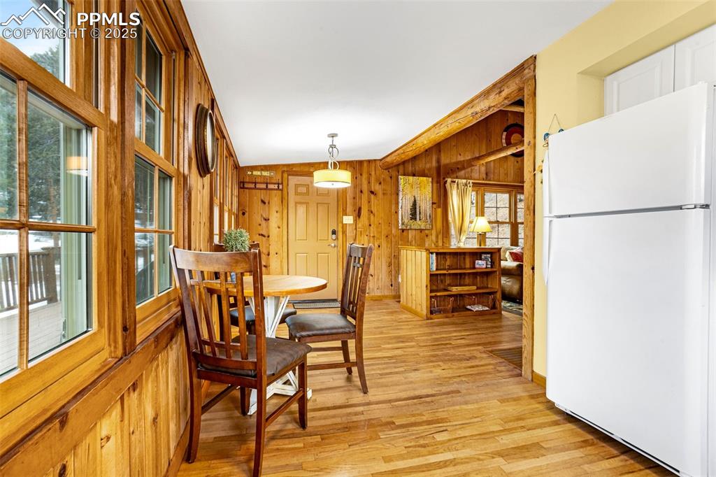 5870 Paona Road Cascade, CO 80809 - Photo 9 of 32 a porch with a table and chairs in it