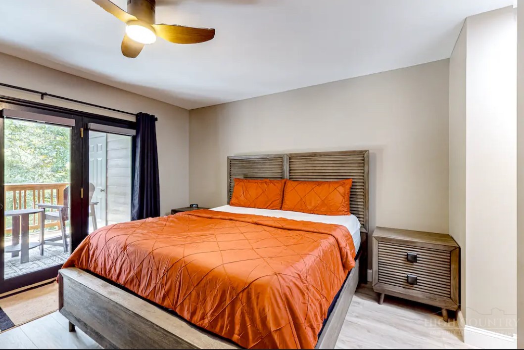 190 Still Lake Drive, Unit 321 Boone, NC 28607 - Photo 12 of 30 a bedroom with a bed and window