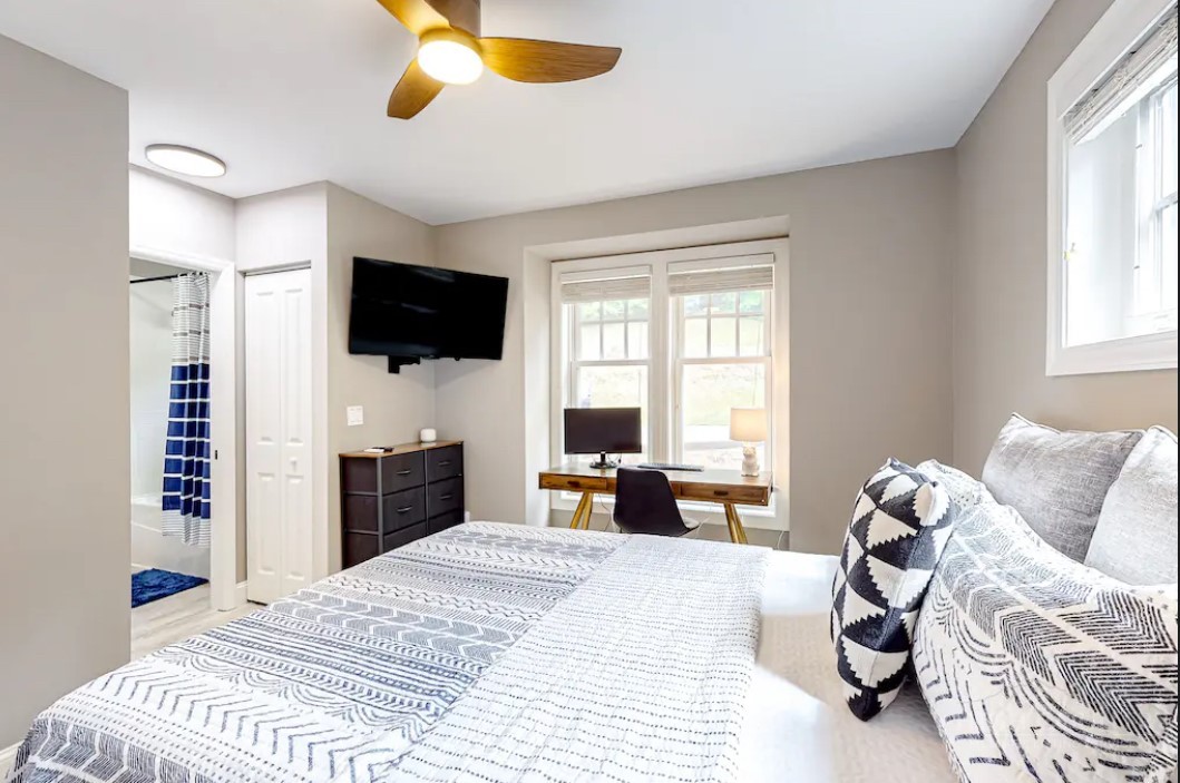 190 Still Lake Drive, Unit 321 Boone, NC 28607 - Photo 16 of 30 a bedroom with a bed and a flat screen tv