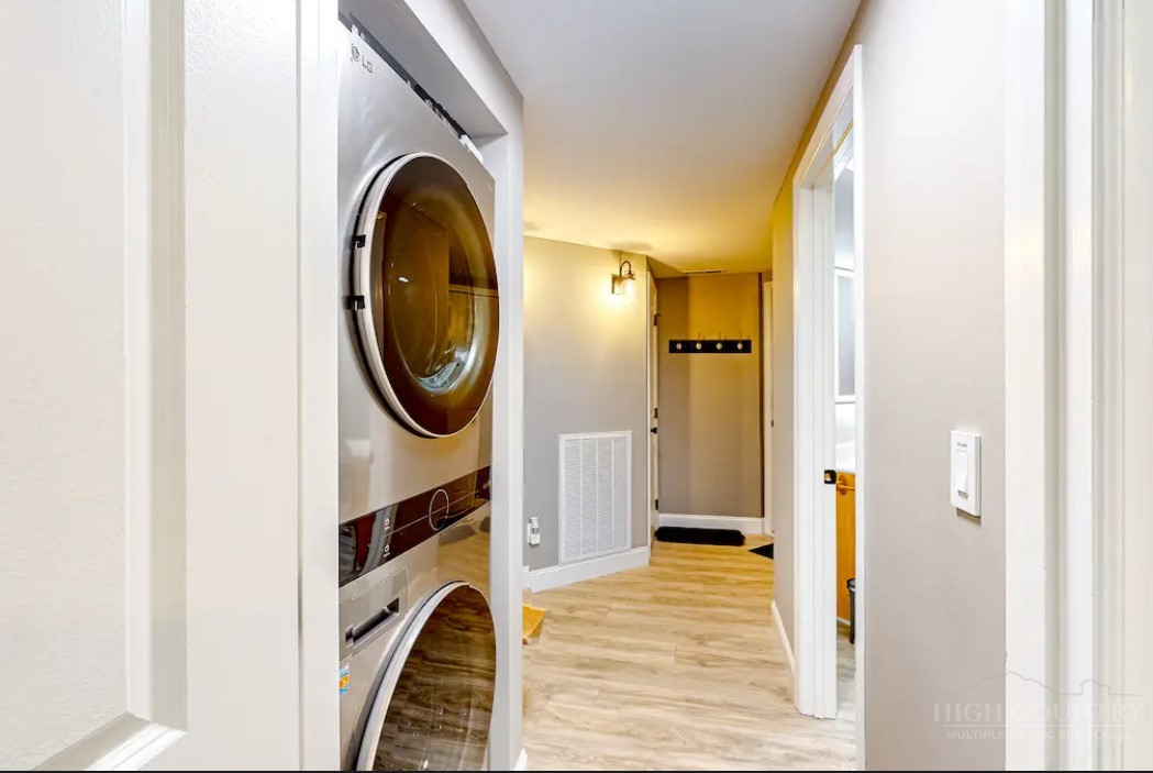 190 Still Lake Drive, Unit 321 Boone, NC 28607 - Photo 17 of 30 a view of a bedroom with washer and dryer