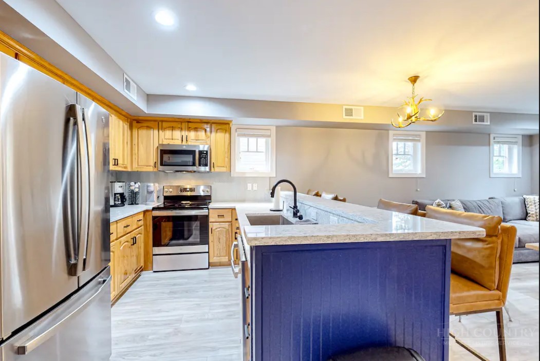 190 Still Lake Drive, Unit 321 Boone, NC 28607 - Photo 7 of 30 a kitchen with a sink stove and refrigerator