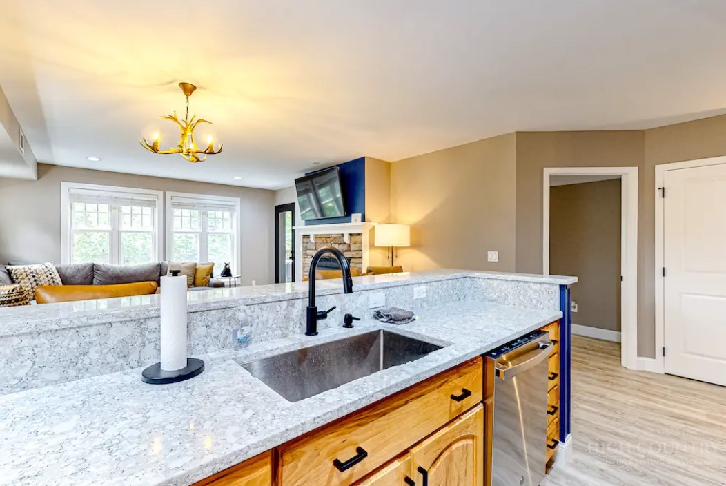 190 Still Lake Drive, Unit 321 Boone, NC 28607 - Photo 8 of 30 a kitchen with sink a counter top space and living room