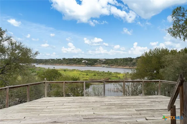 a view of a balcony with wooden floor