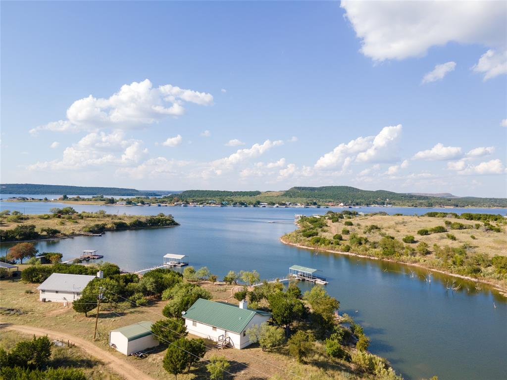 3500 Hog Bend, Unit 135 Graford, TX 76449 - Photo 1 of 34 a view of a lake and mountains in the background