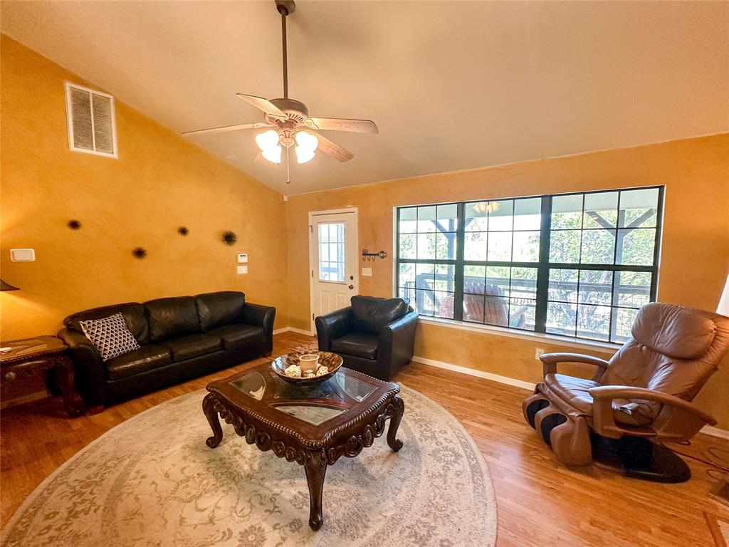 3500 Hog Bend, Unit 135 Graford, TX 76449 - Photo 13 of 34 a living room with furniture and a large window