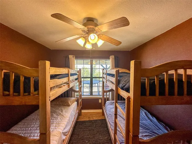 a view of a hallway with a livingroom with furniture