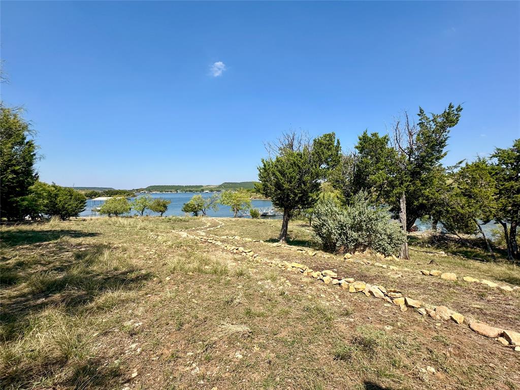 3500 Hog Bend, Unit 135 Graford, TX 76449 - Photo 24 of 34 a view of a yard with trees