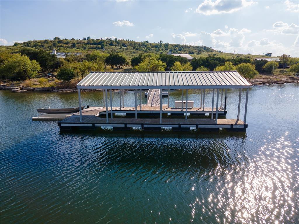 3500 Hog Bend, Unit 135 Graford, TX 76449 - Photo 7 of 34 an aerial view of a house with a garden and lake view