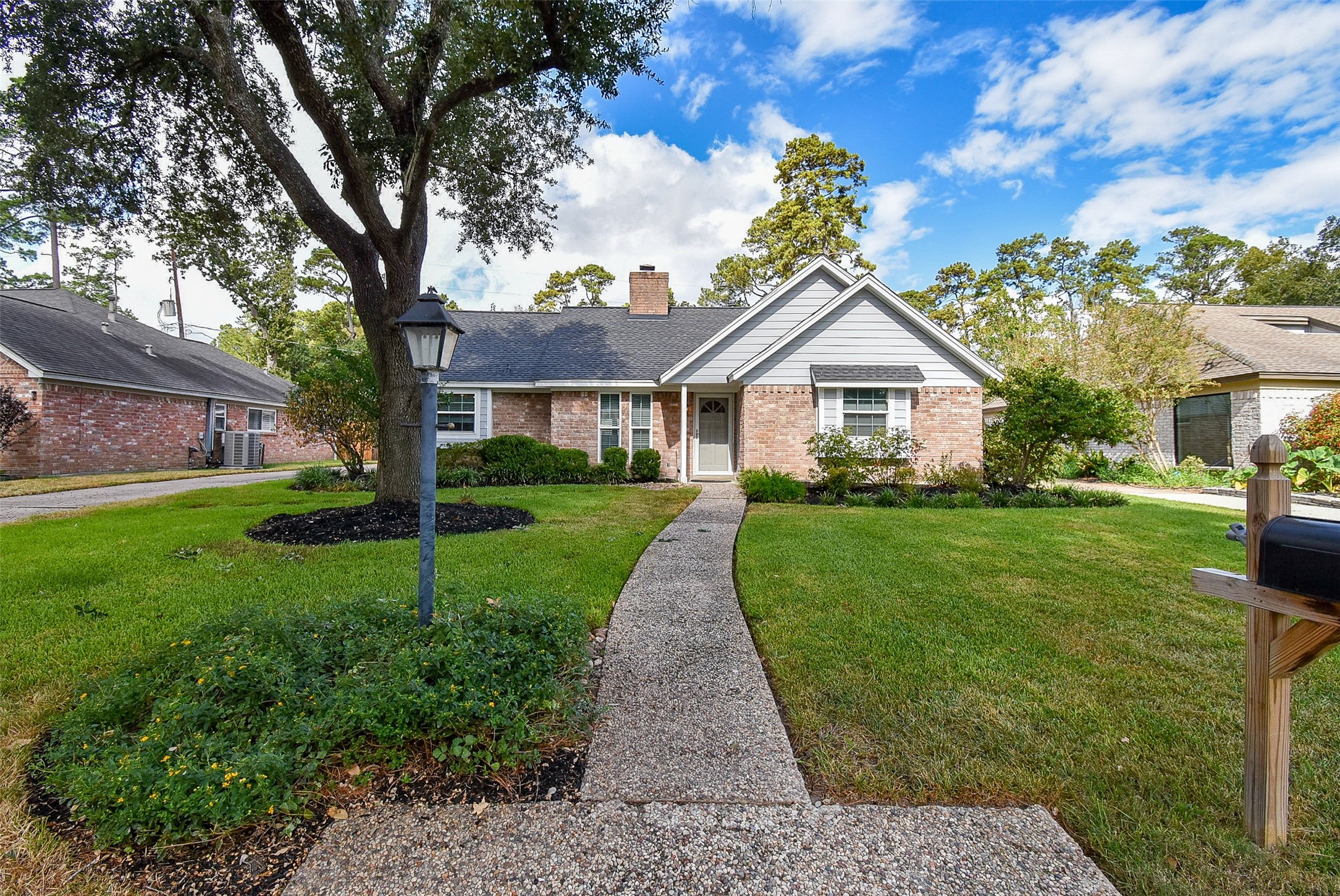 7814 Friars Ct Lane Spring, TX 77379 - Photo 1 of 17 a front view of a house with a yard