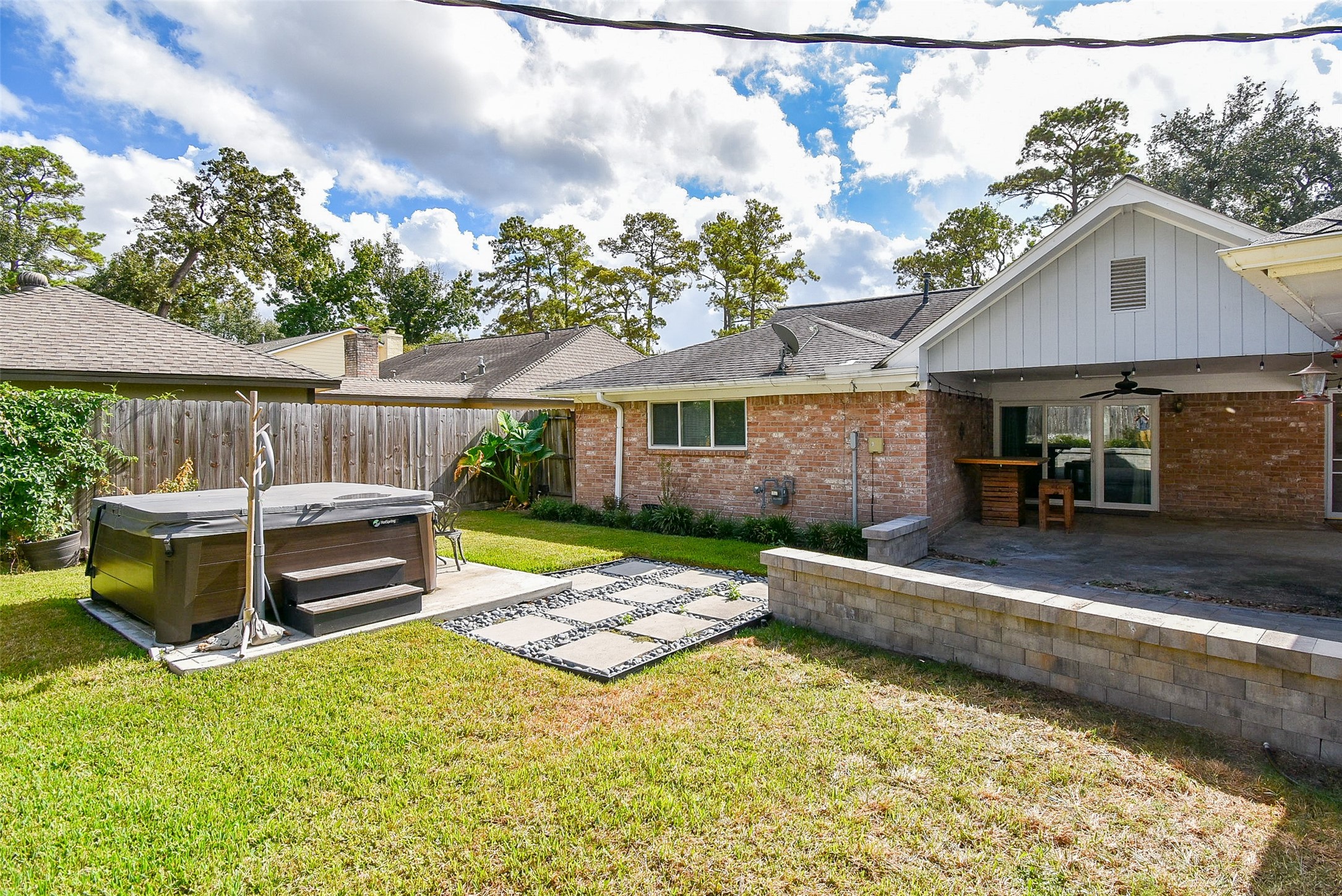 7814 Friars Ct Lane Spring, TX 77379 - Photo 15 of 17 a view of a chair and table in backyard of the house