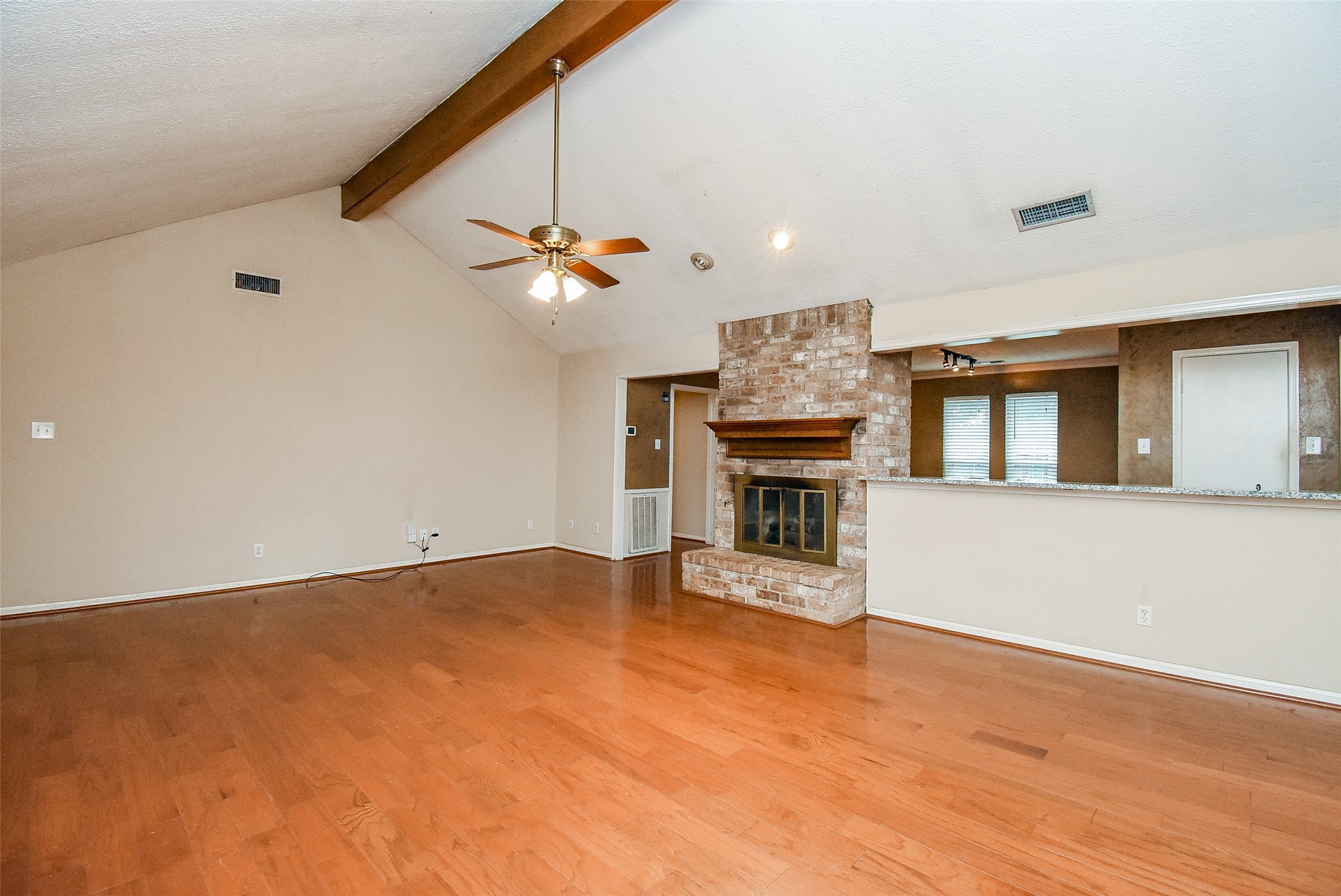 7814 Friars Ct Lane Spring, TX 77379 - Photo 3 of 17 a view of an empty room with a fireplace and a window