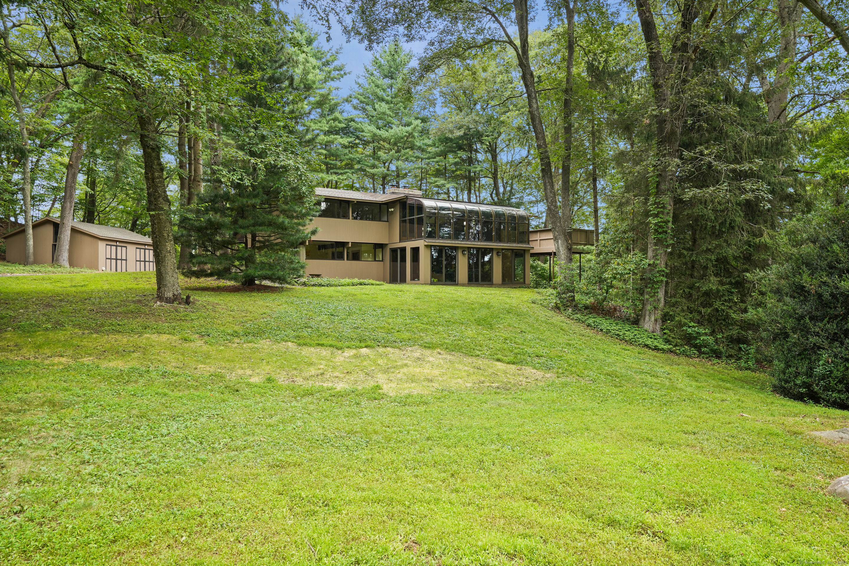 12 Mountain Road Wilton, CT 06897 - Photo 1 of 1 a house view with a garden space