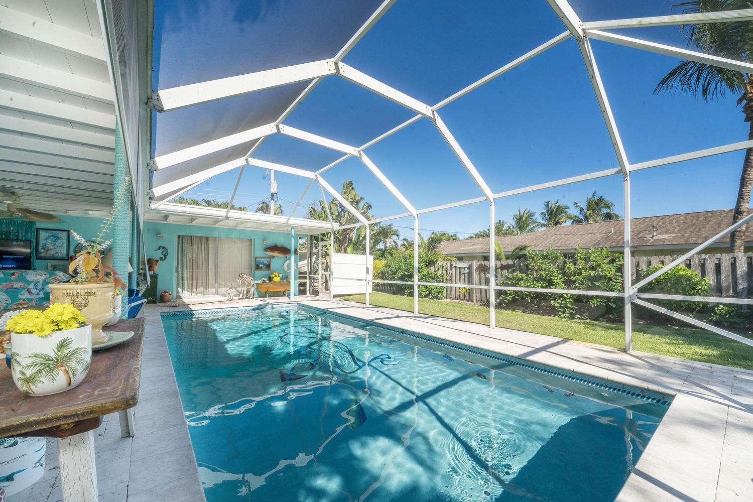100 River Drive Tequesta, FL 33469 - Photo 16 of 54 a view of a swimming pool with a patio