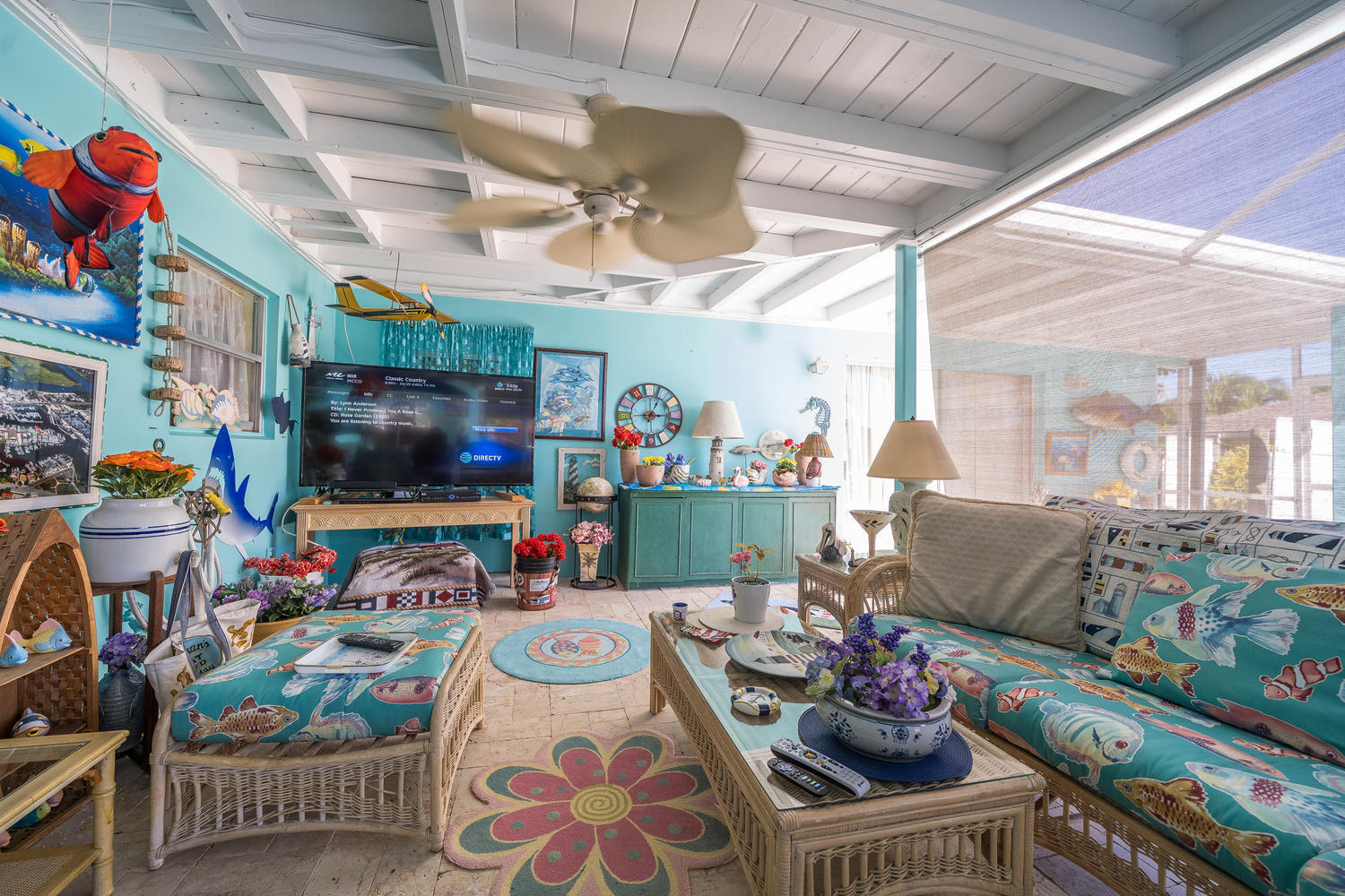 100 River Drive Tequesta, FL 33469 - Photo 21 of 54 a living room with lots of furniture and a flat screen tv