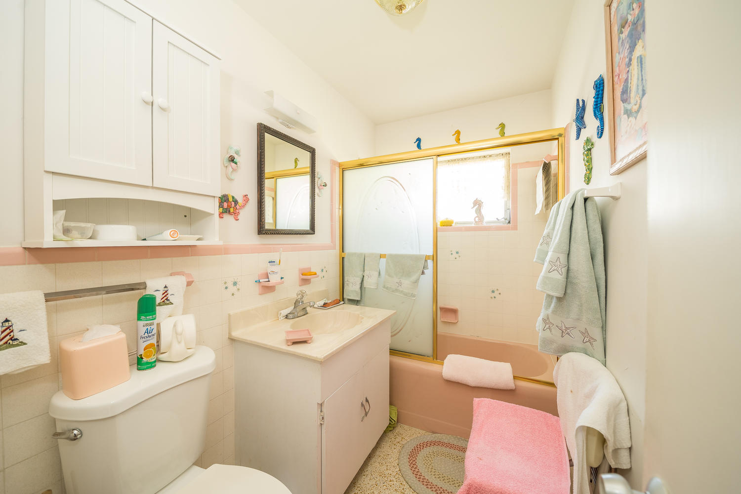 100 River Drive Tequesta, FL 33469 - Photo 23 of 54 a bathroom with a sink mirror vanity and toilet