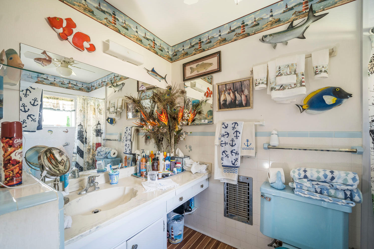100 River Drive Tequesta, FL 33469 - Photo 25 of 54 a bathroom with a sink mirror and vanity