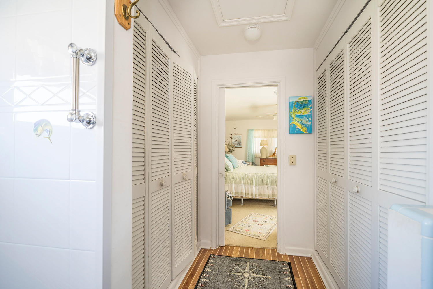 100 River Drive Tequesta, FL 33469 - Photo 27 of 54 a walk in closet with wooden floor