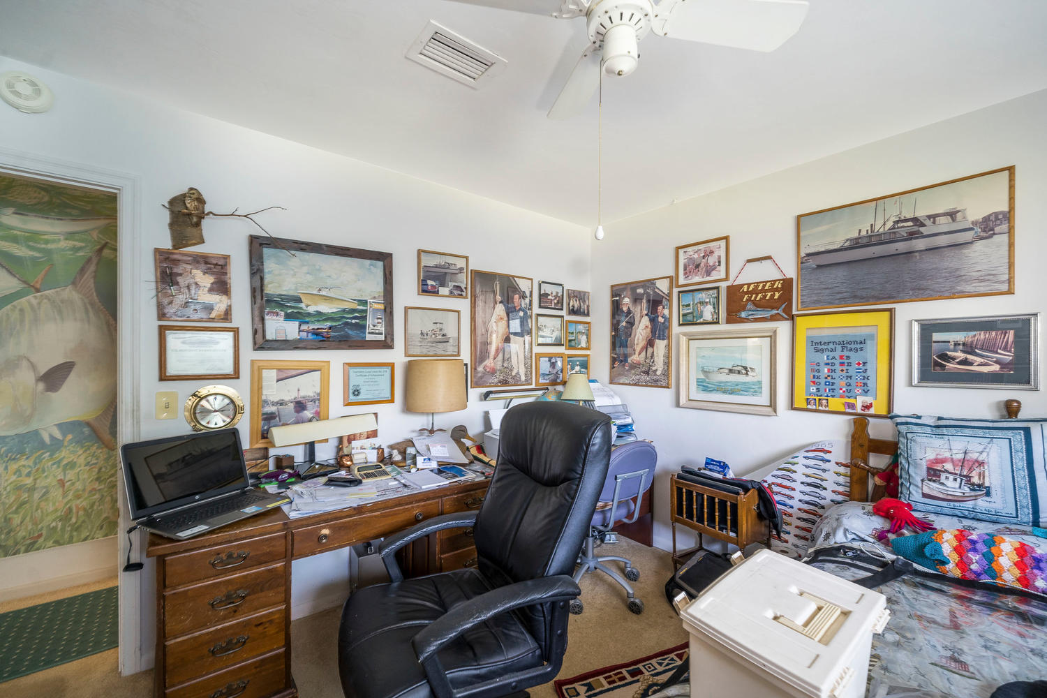 100 River Drive Tequesta, FL 33469 - Photo 28 of 54 a room with furniture and a window