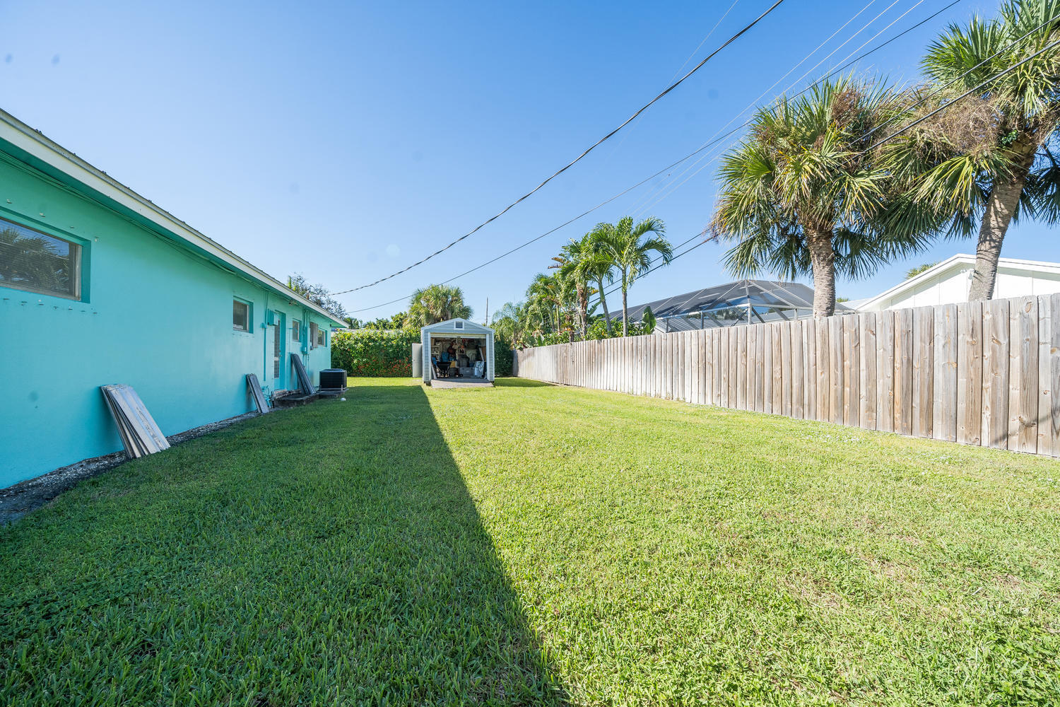 100 River Drive Tequesta, FL 33469 - Photo 30 of 54 a view of a backyard with a garden