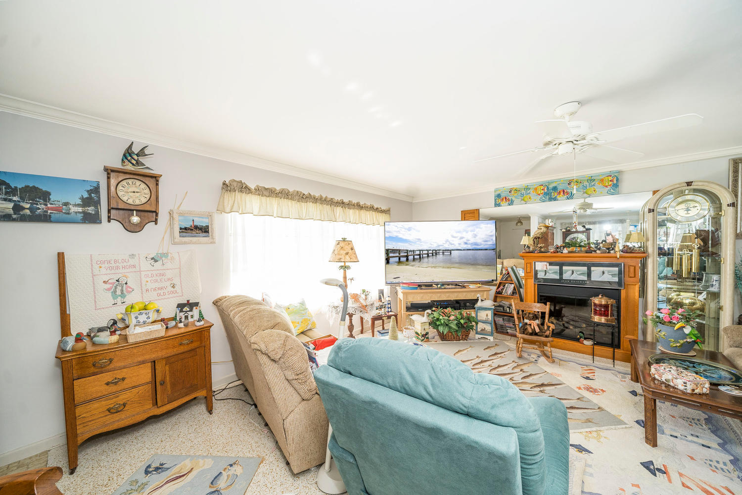 100 River Drive Tequesta, FL 33469 - Photo 3 of 54 a living room with furniture and a fireplace