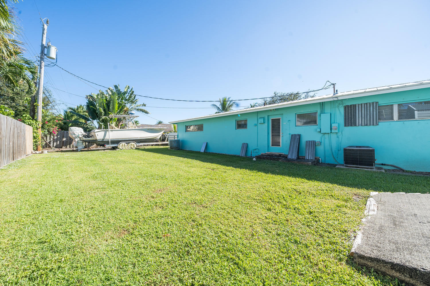 100 River Drive Tequesta, FL 33469 - Photo 32 of 54 a view of a house with a yard