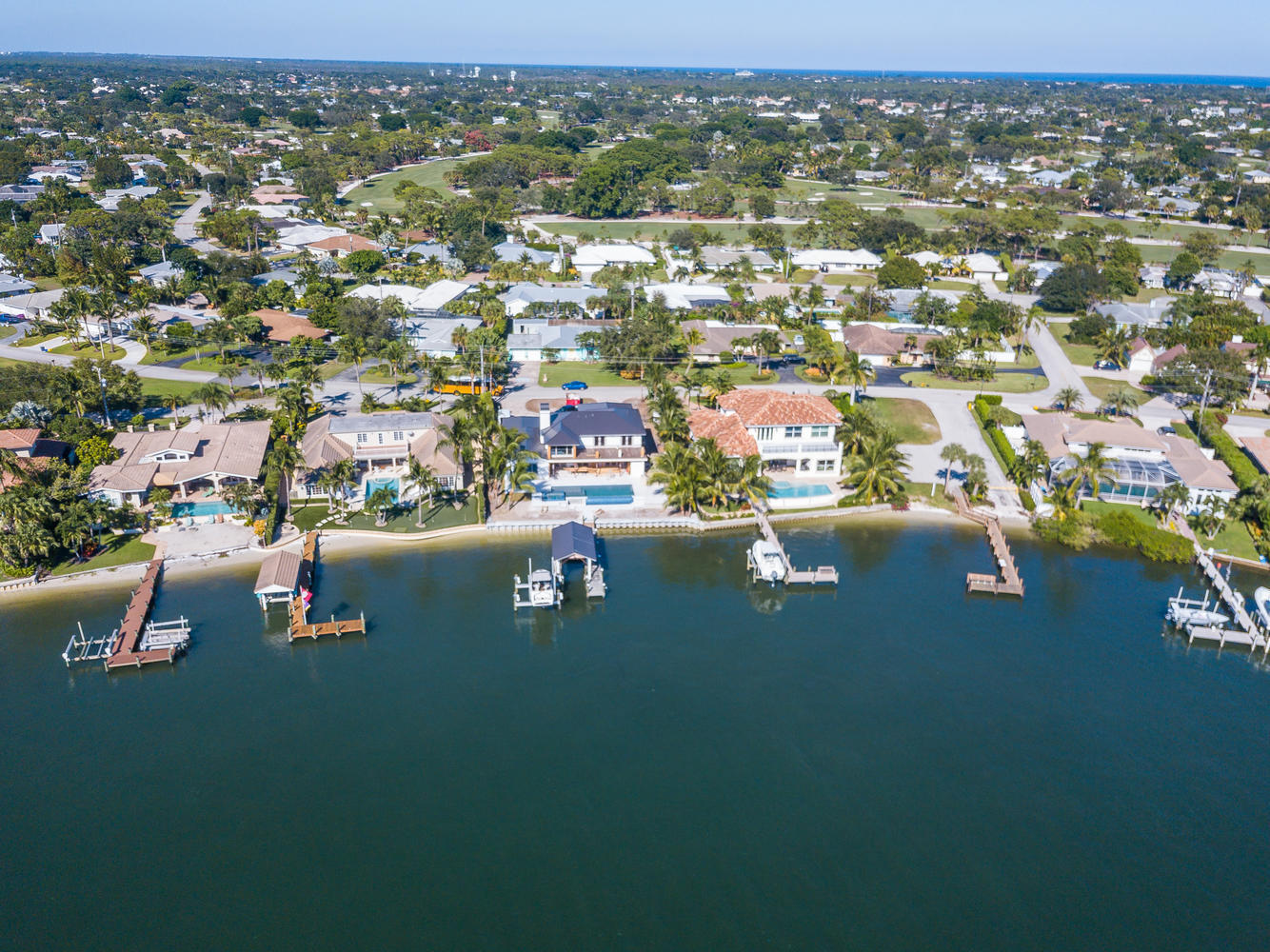 100 River Drive Tequesta, FL 33469 - Photo 38 of 54 an aerial view of a city with lots of residential buildings