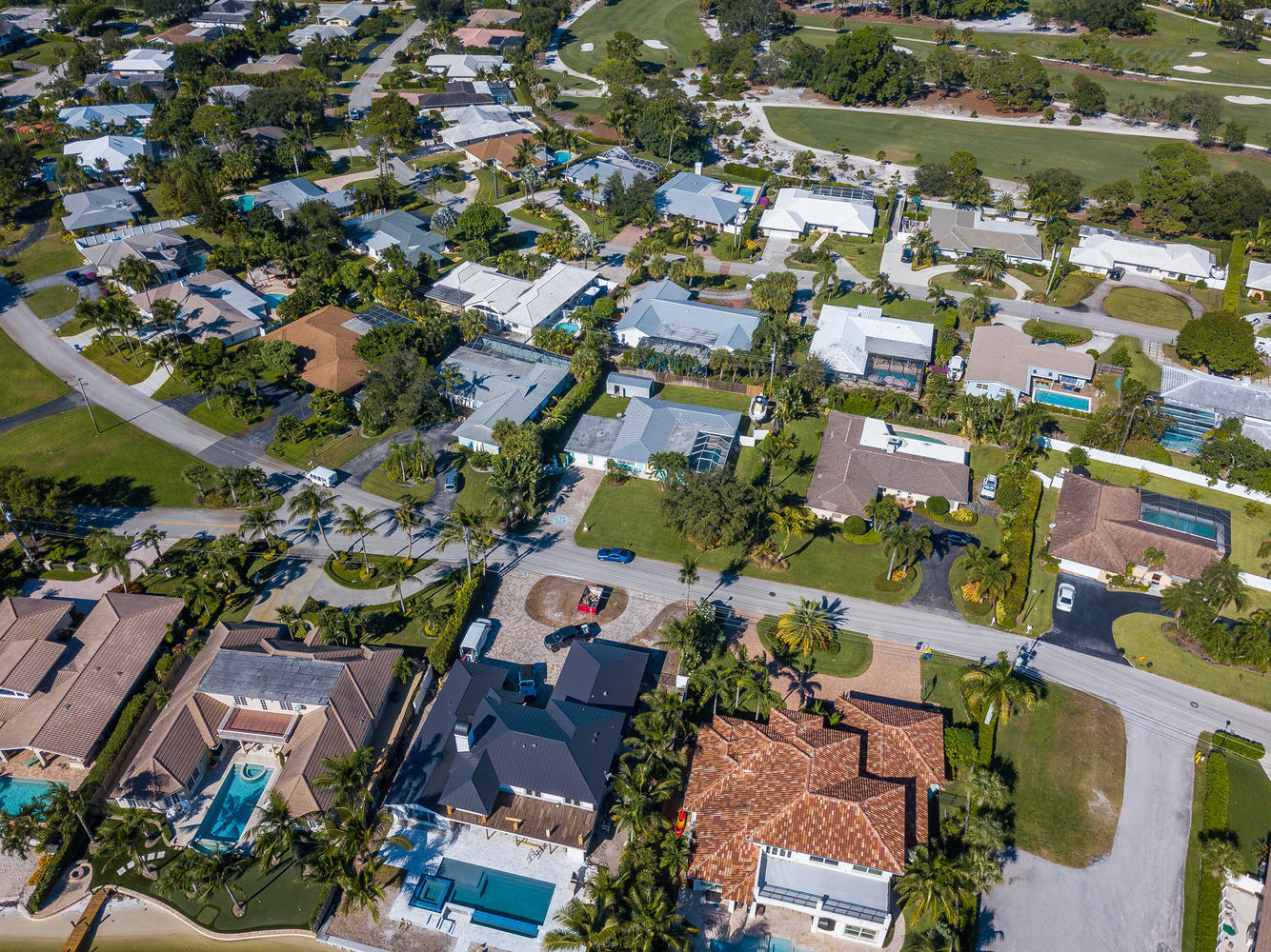 100 River Drive Tequesta, FL 33469 - Photo 40 of 54 an aerial view of a city with lots of residential buildings